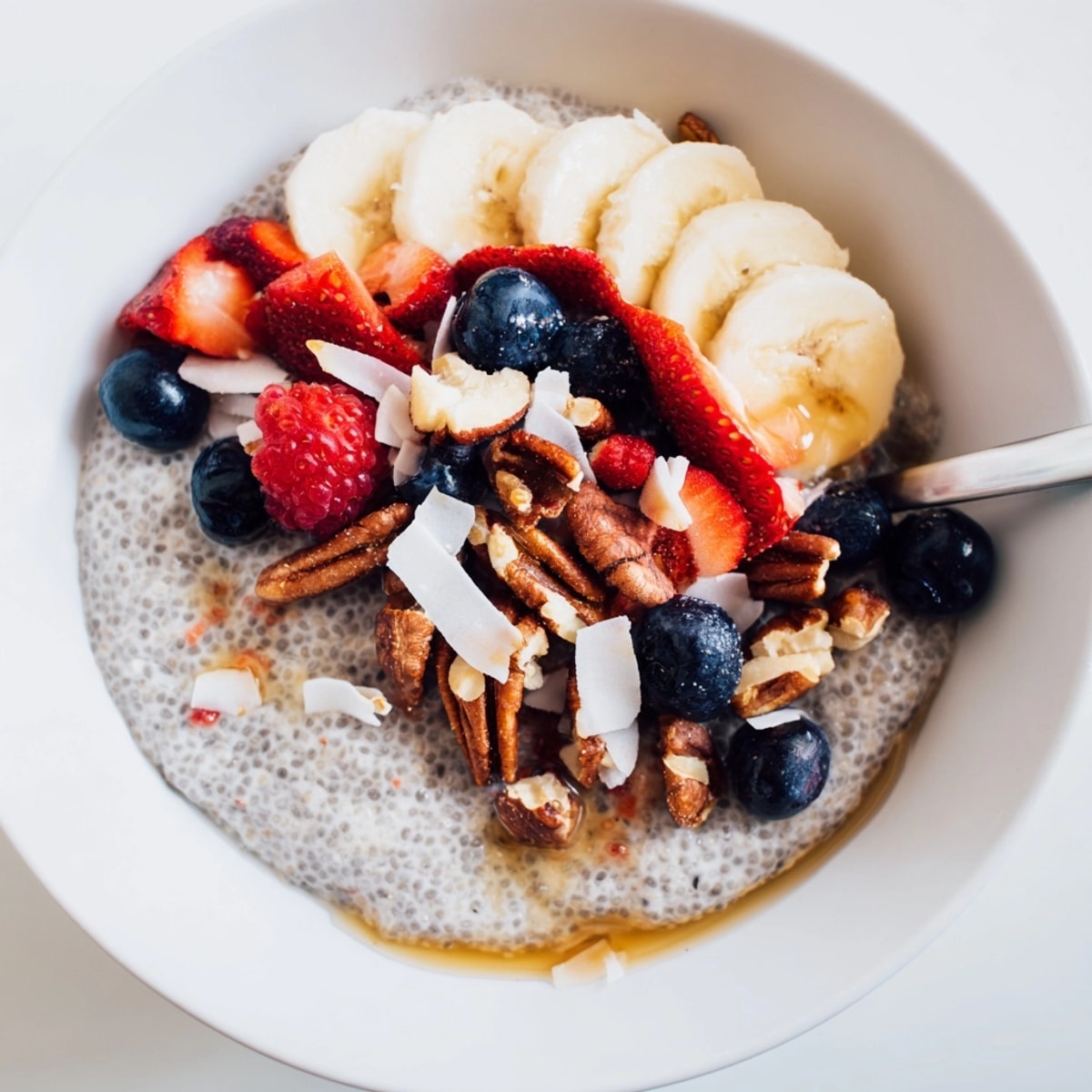 Easy vegan Maple Chia Breakfast Bowl recipe: quick, healthy breakfast, garnished with fresh fruit.