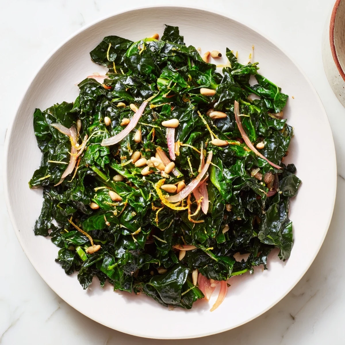 Fragrant garlic and zesty lemon coat tender Winter Greens, a light and healthful Mediterranean recipe.