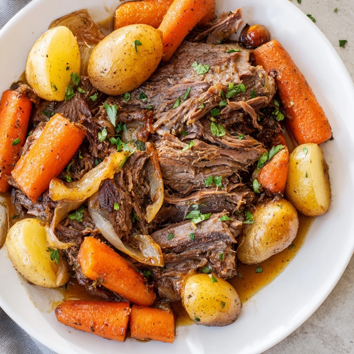 Tender slow cooker pot roast with carrots, a classic family meal, is perfect for a cozy evening.