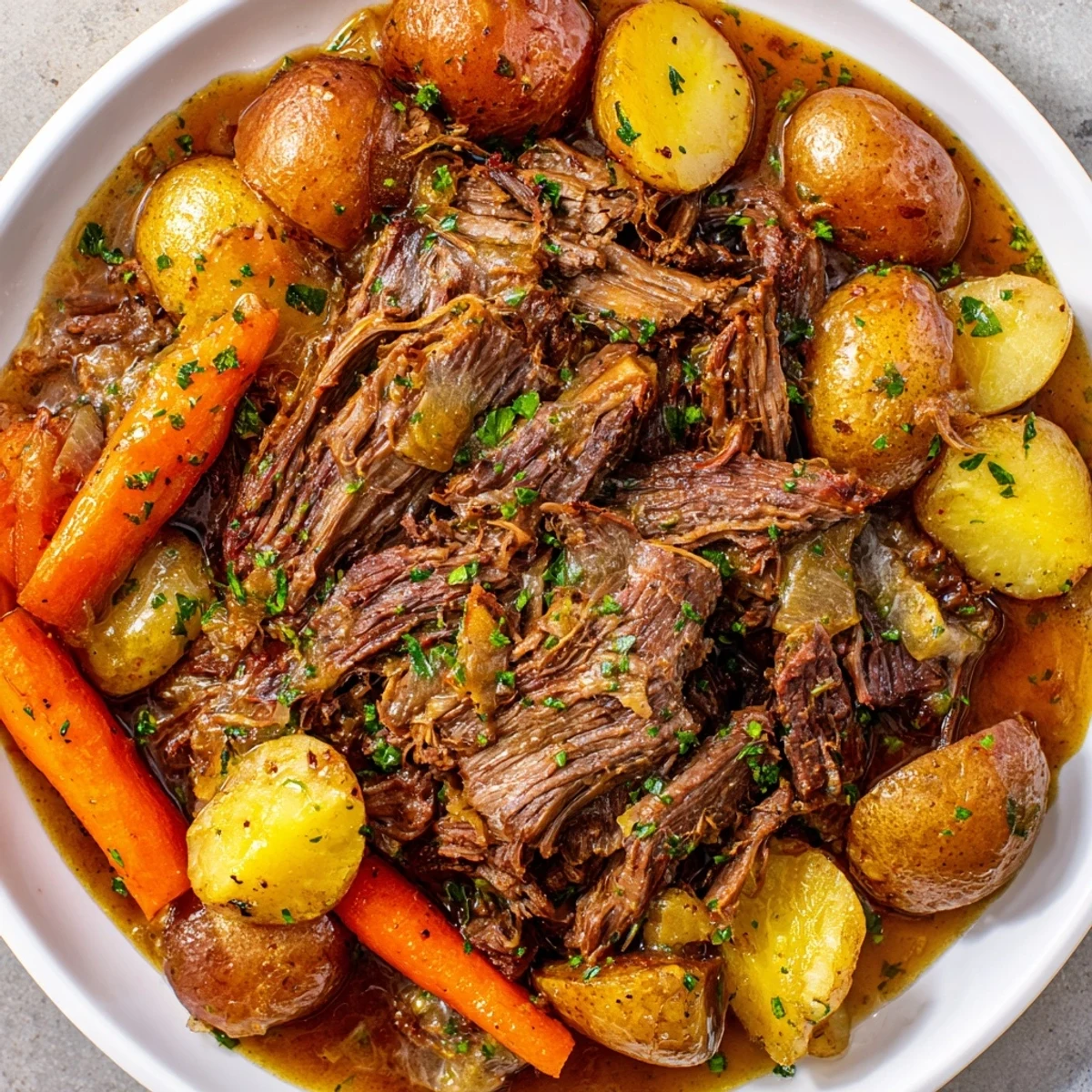 Hearty slow cooker pot roast with carrots: imagine the savory aroma of this comforting, home-cooked American classic.