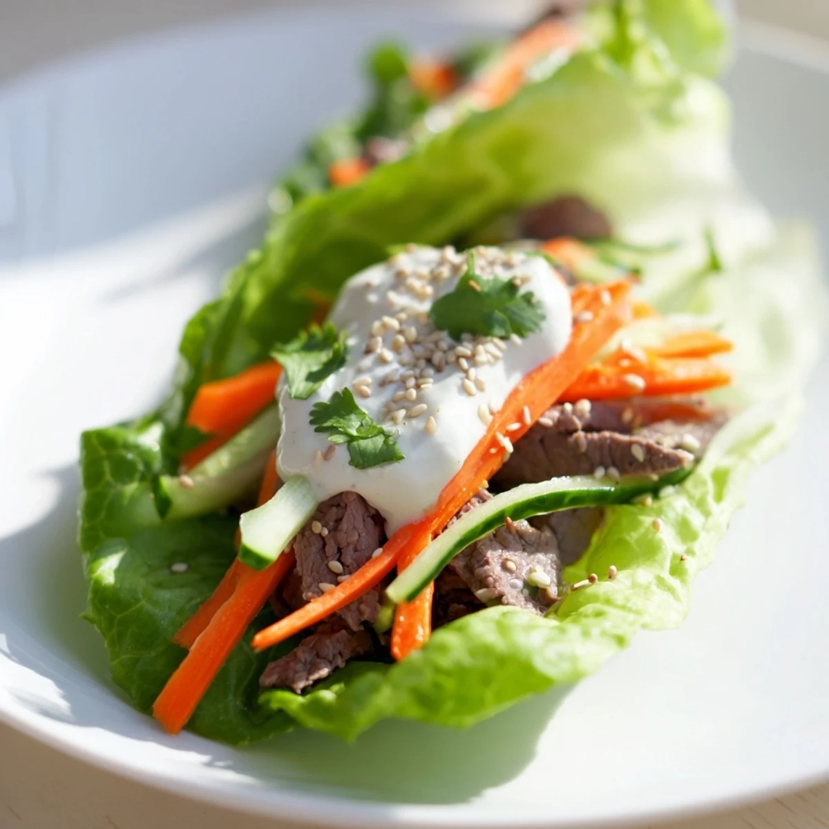 Freshly rolled Beef Wrap with Lettuce and cucumber slices, garnished with cilantro on a rustic board.