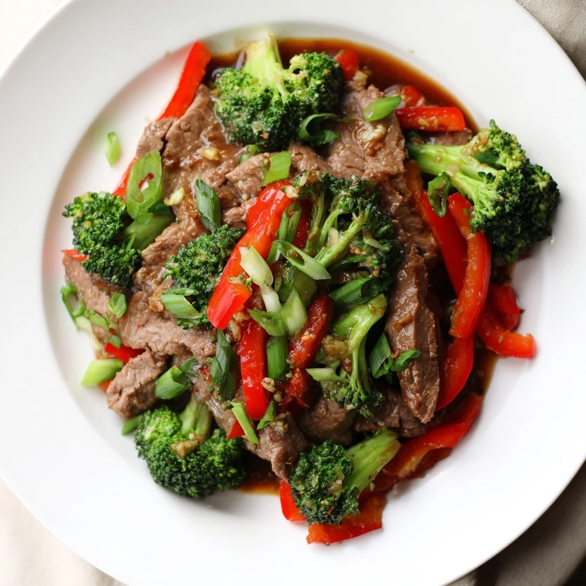 Steamy Beef and Broccoli Stir Fry with Garlic Soy Sauce sizzles in a wok with tender beef and bright green broccoli florets.
