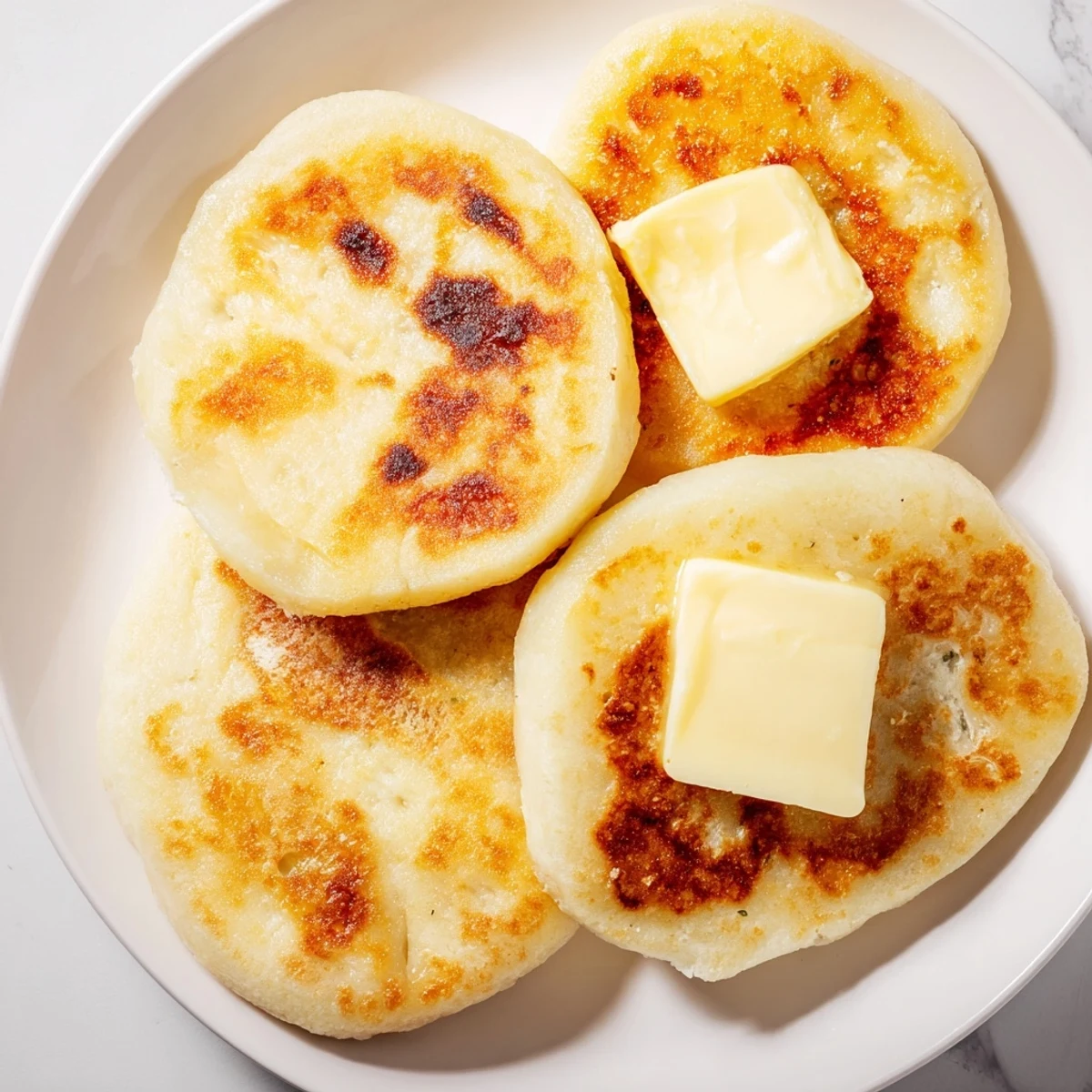 Freshly cooked Irish Potato Bread Farls with Salted Butter show a soft, fluffy interior and crisp edges.
