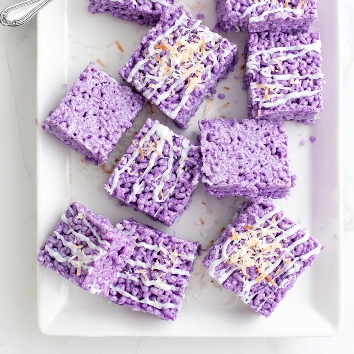 Purple yam marshmallow cereal bars stacked on a wooden cutting board with coconut garnish