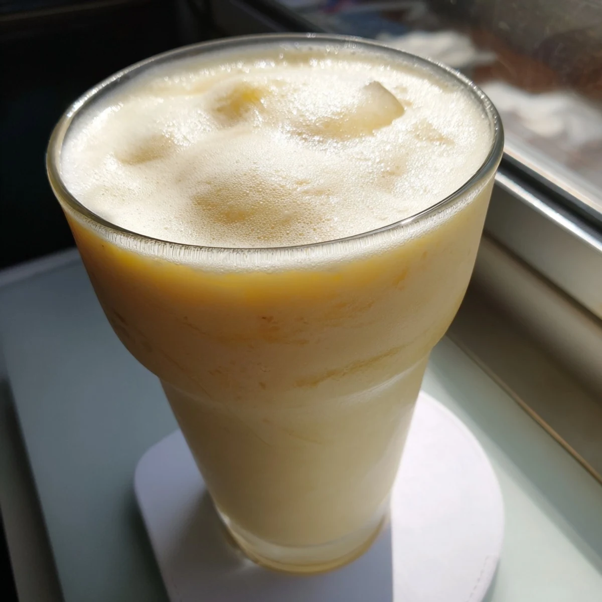 Tropical durian smoothie blended with ice, coconut milk, and sweet honey for refreshing drink