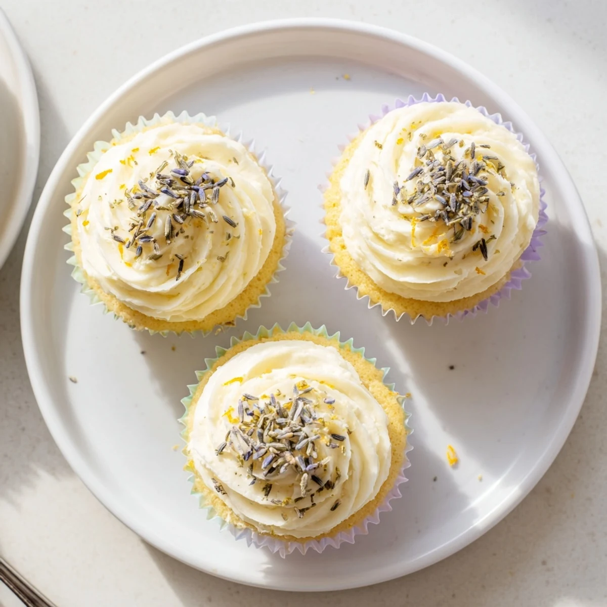 Light and airy Lemon Lavender Cupcakes arranged on a wooden serving board for spring dessert