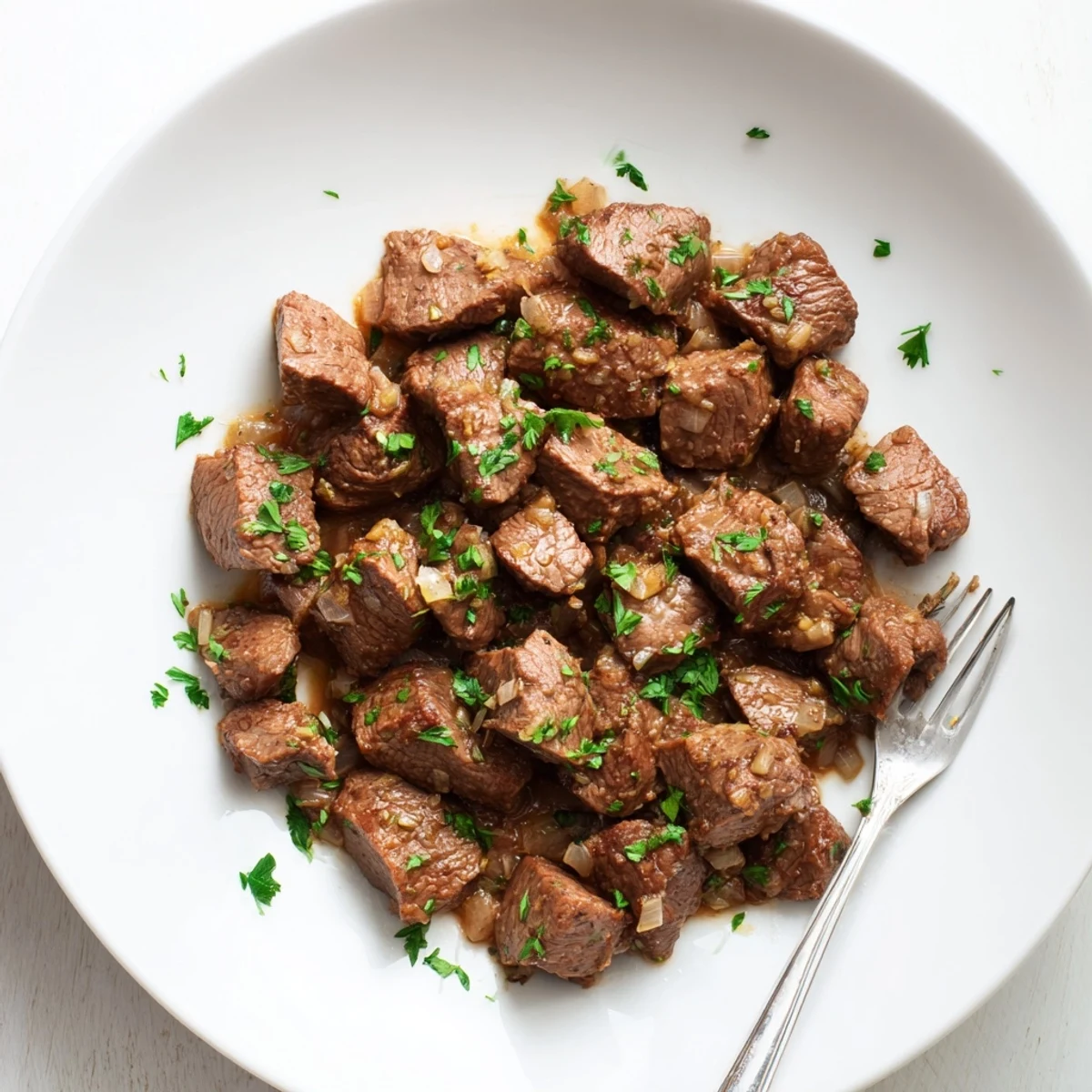 Succulent cubes of sirloin steak slow cooked with onions and aromatic herbs