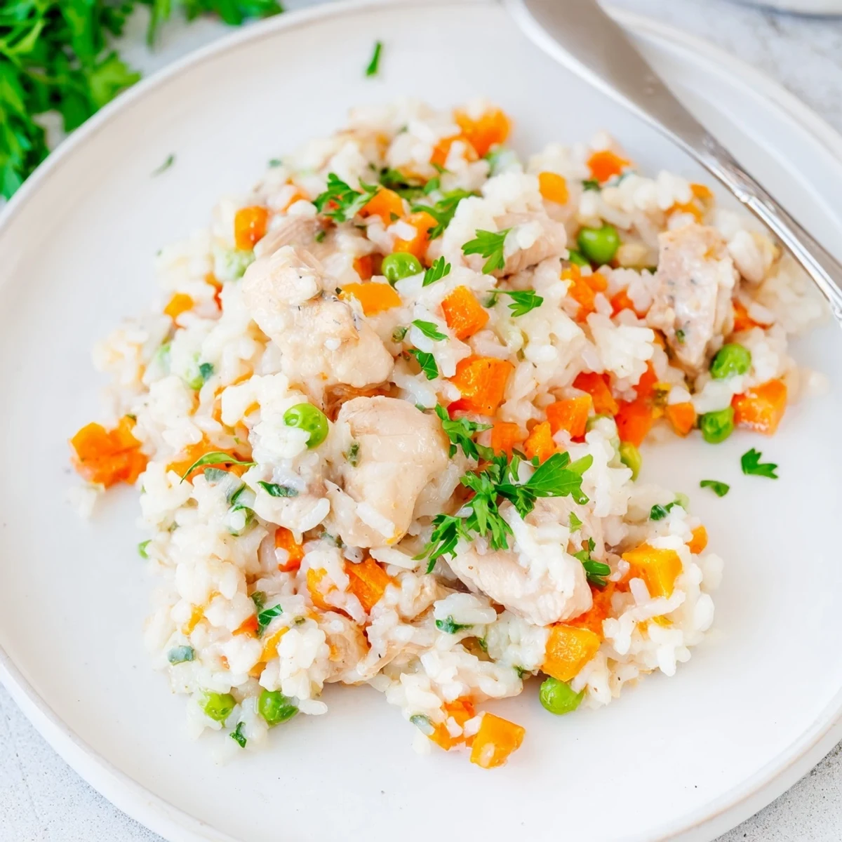 Comforting one-pot meal featuring juicy chicken pieces mixed with perfectly cooked rice and vegetables