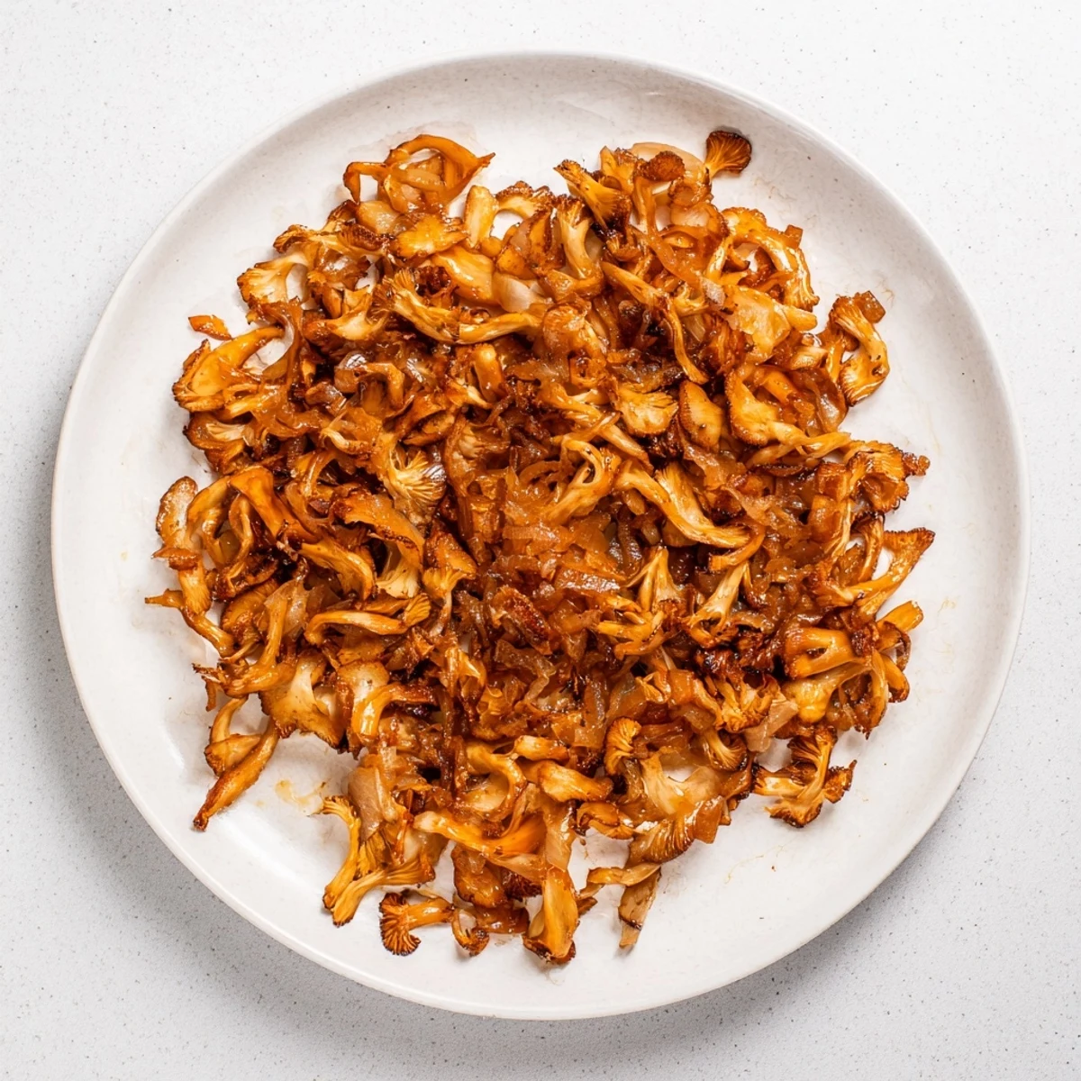 Spicy mushroom vegan carnitas with crisp edges and fresh cilantro garnish