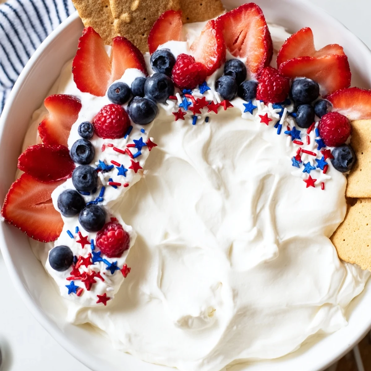How To Make Star Spangled Cheesecake Dip, creamy with berries and sprinkles.