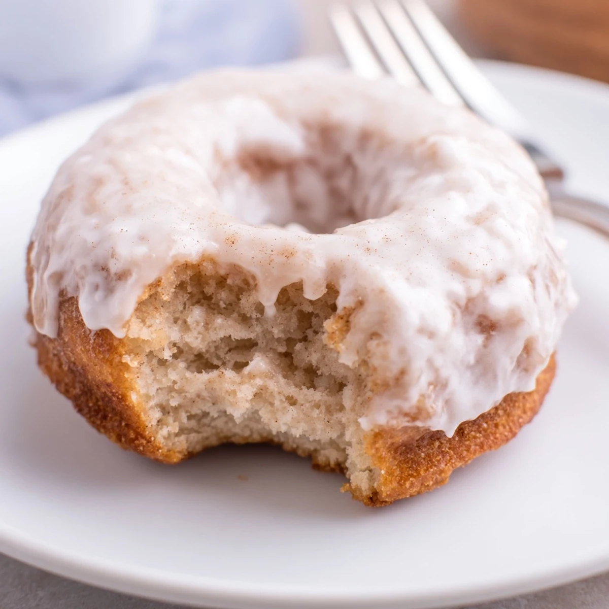 Golden, moist Banana Donuts cooling on a wire rack, warm banana aroma