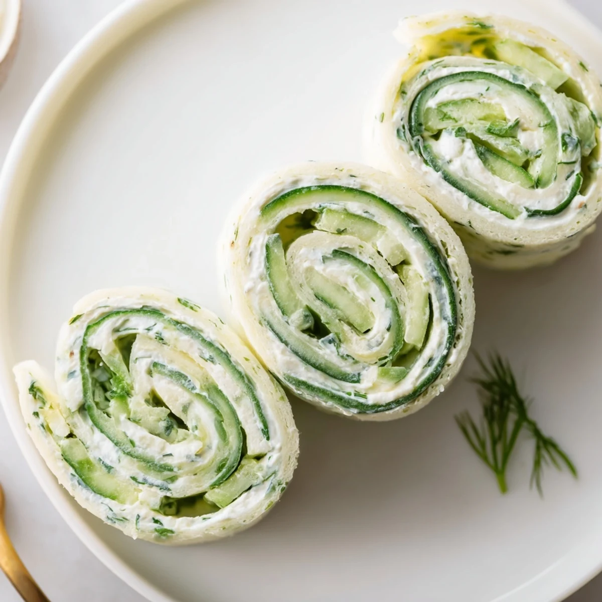 Party-ready Cucumber And Dill Pinwheels sliced, soft tortilla spirals, lemon-kissed cream cheese